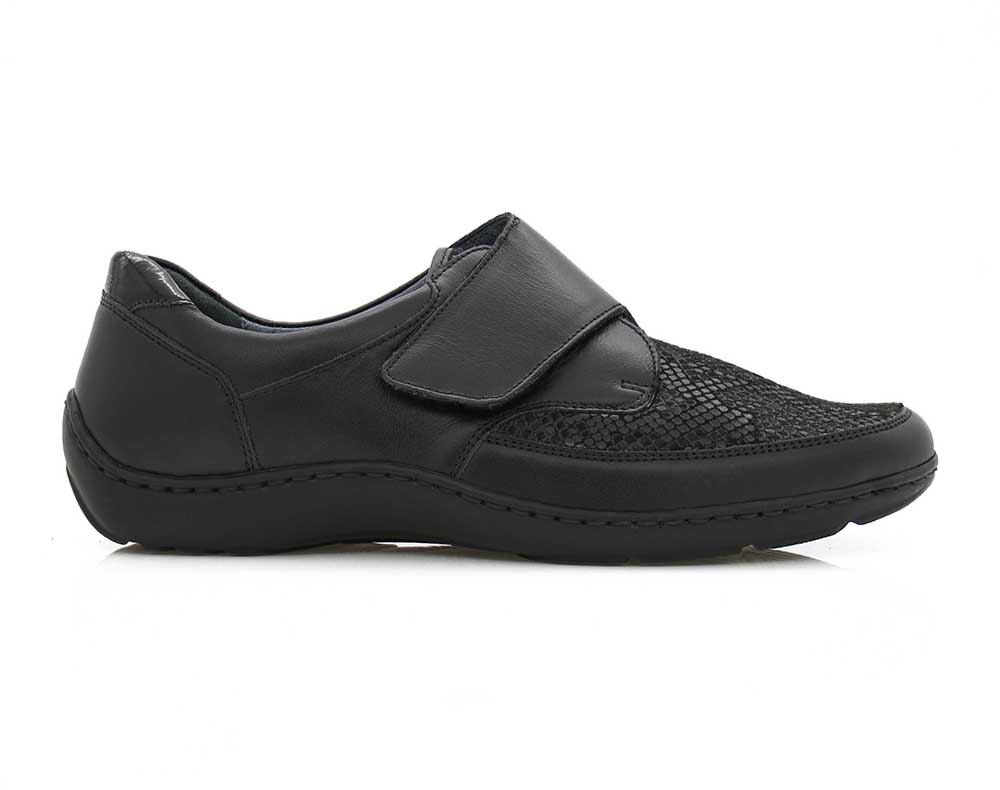 A pair of black stretch-upper shoes designed to provide comfort and support for people with bunions. The shoes have a wide, roomy toe box and a flexible sole to alleviate pressure on the bunion area.