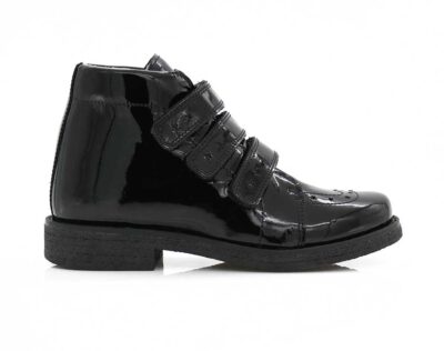 A right-hand side view of the Kinysi Molly Velcro, in Black Patent.