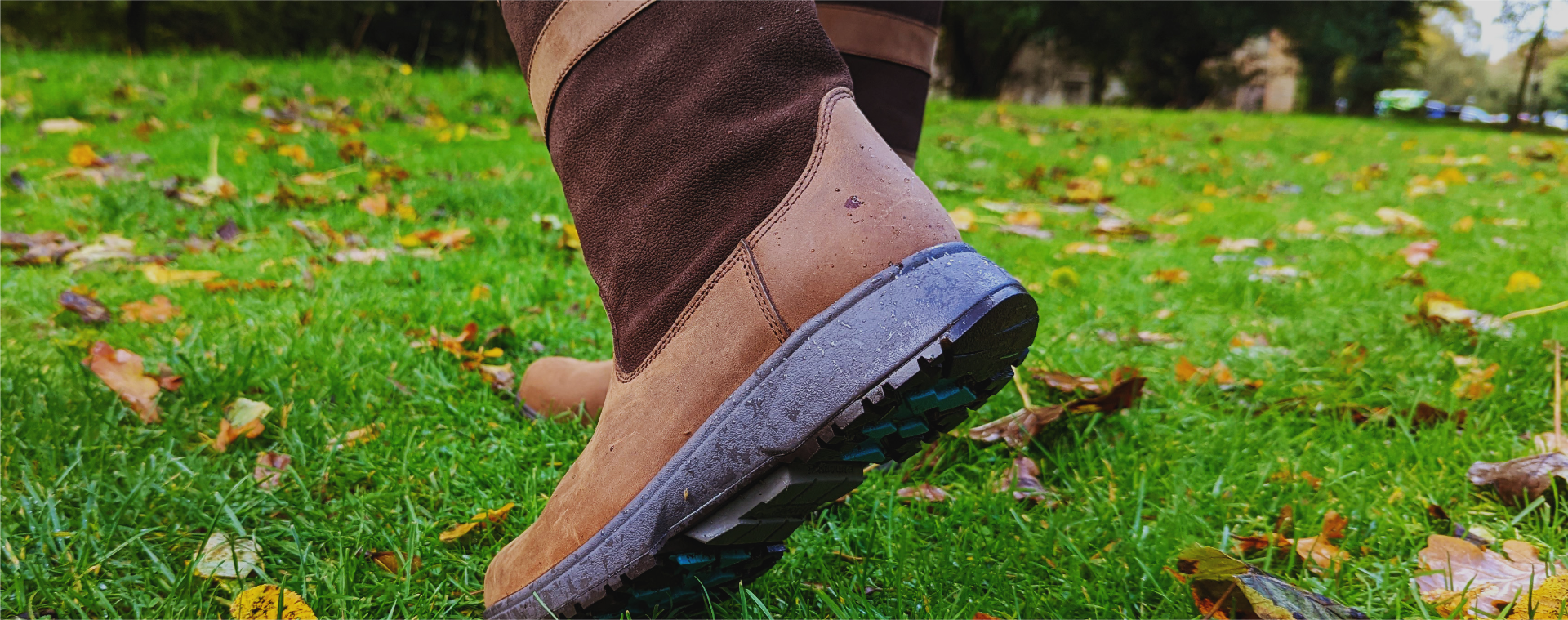 A close-up of a pair of comfortable, supportive outdoor walking boots, ideal for improving posture and reducing knee pain, as recommended by shoefit.uk.