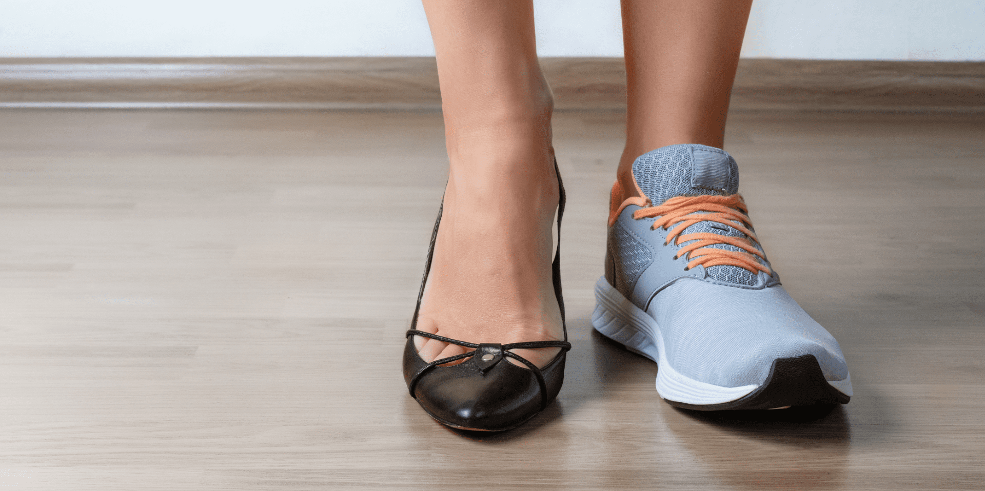 Two feet - one in a high heel, one in a trainer, emphasizing the importance of choosing the correct footwear for Morton's Neuroma. 