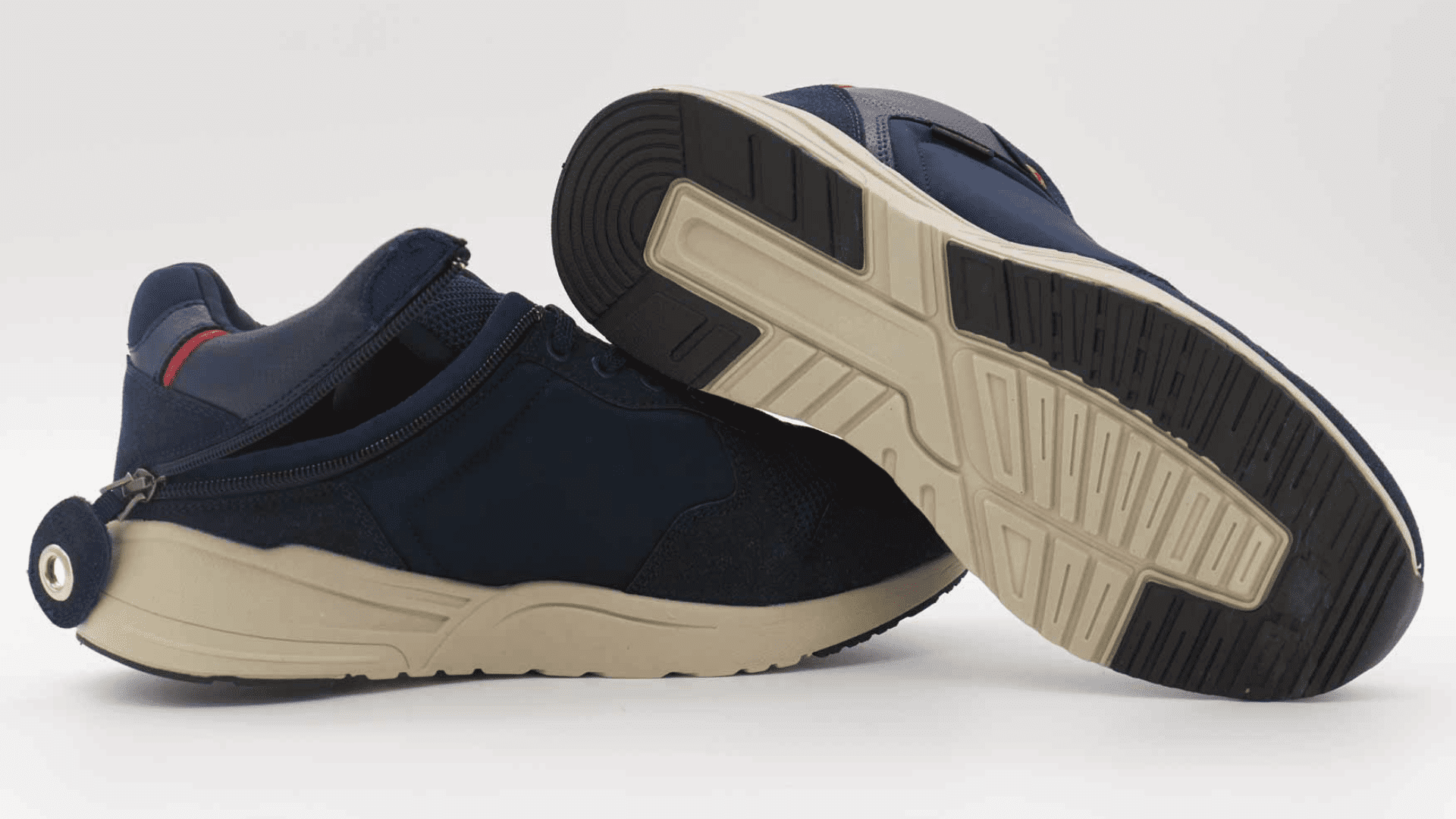 A lifestlye image of Friendly Shoes Voyage – Navy/Peach Casual Shoes. These shoes are designed to be easy-on-and-off to assist with quality of life. 
