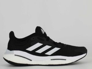 A side view of the Adidas Solarcontrol, in Core Black/Cloud White/Grey Five.