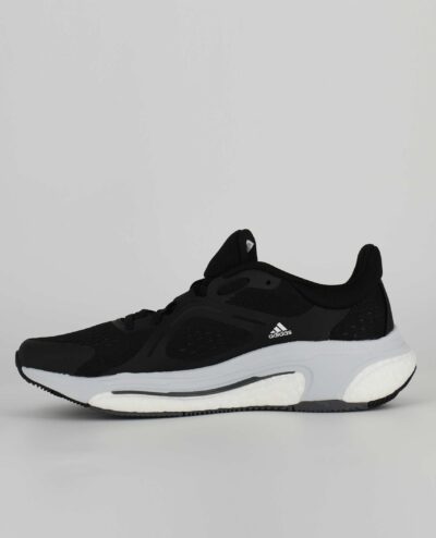 A side view of the Adidas Solarcontrol, in Core Black/Cloud White/Grey Five.