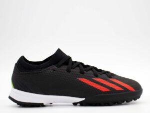 A side view of the Adidas X Speedportal.3 Turf, in Core Black/Solar Red/Solar Green.