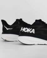 A close-up of the HOKA Clifton 9, in Black/White.
