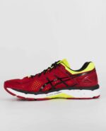 A side view of the Asics Gel Kayano 22, in Red Pepper/Black/Flash Yellow.