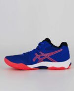 A side view of the Asics Netburner Ballistic FF MT 2, in Lapis Lazuli Blue/Blazing Coral.