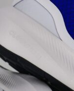 An extreme close-up of the Adidas RunFalcon 3.0 Elastic, in Lucid Blue/Legend Ink/Cloud White.