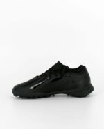 A side view of the X Crazyfast.3 Turf, in Core Black/Core Black/Core Black.