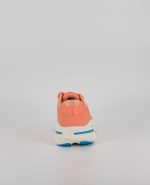 The heel of the Brooks Ghost Max, in Papaya/Apricot/Blue.